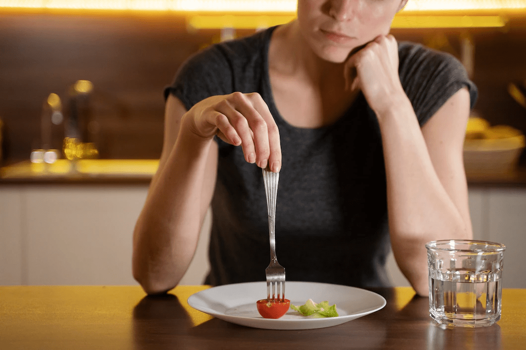 A woman not eating properly.